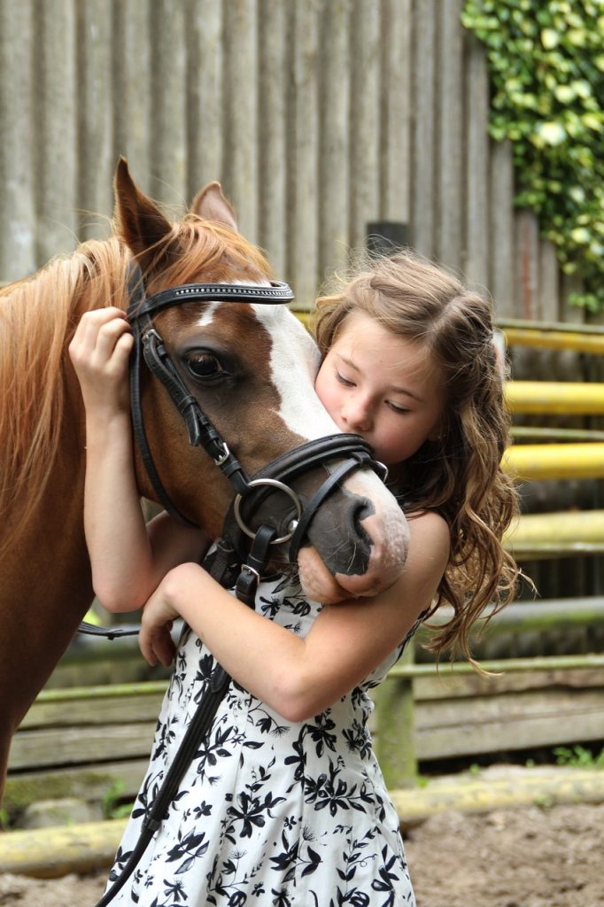 little girl with pony